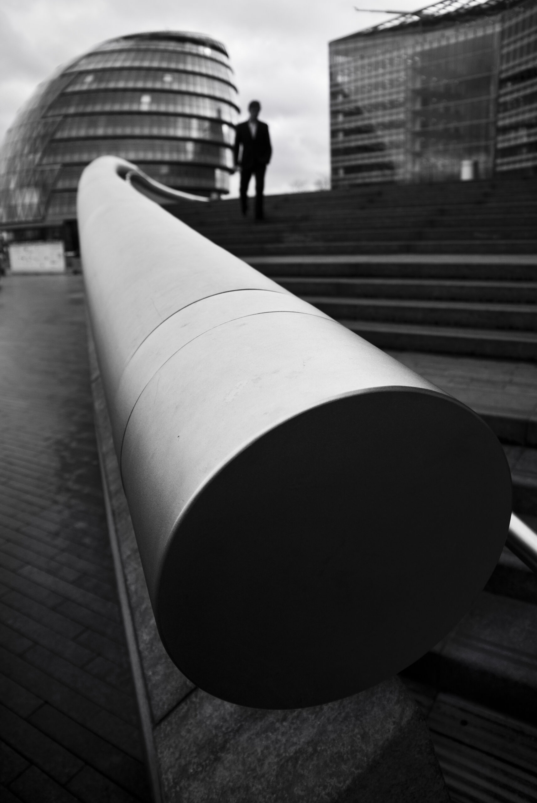Monochrome photo of man standing near handle